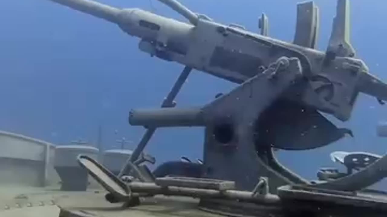 An underwater fair with military equipment