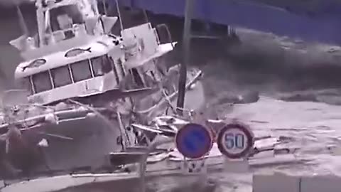 Flood washes cars away and boats inland.