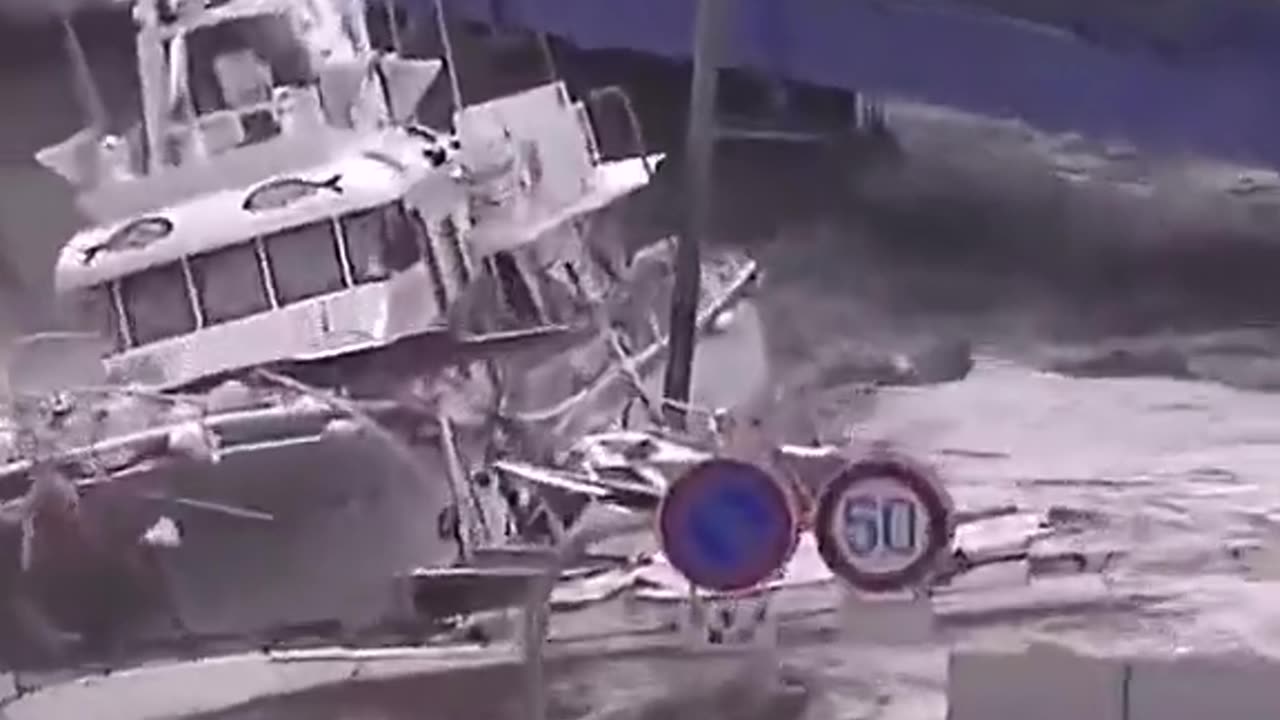 Flood washes cars away and boats inland.