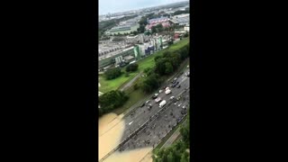 Vehicles left stranded in Malaysia floodwaters