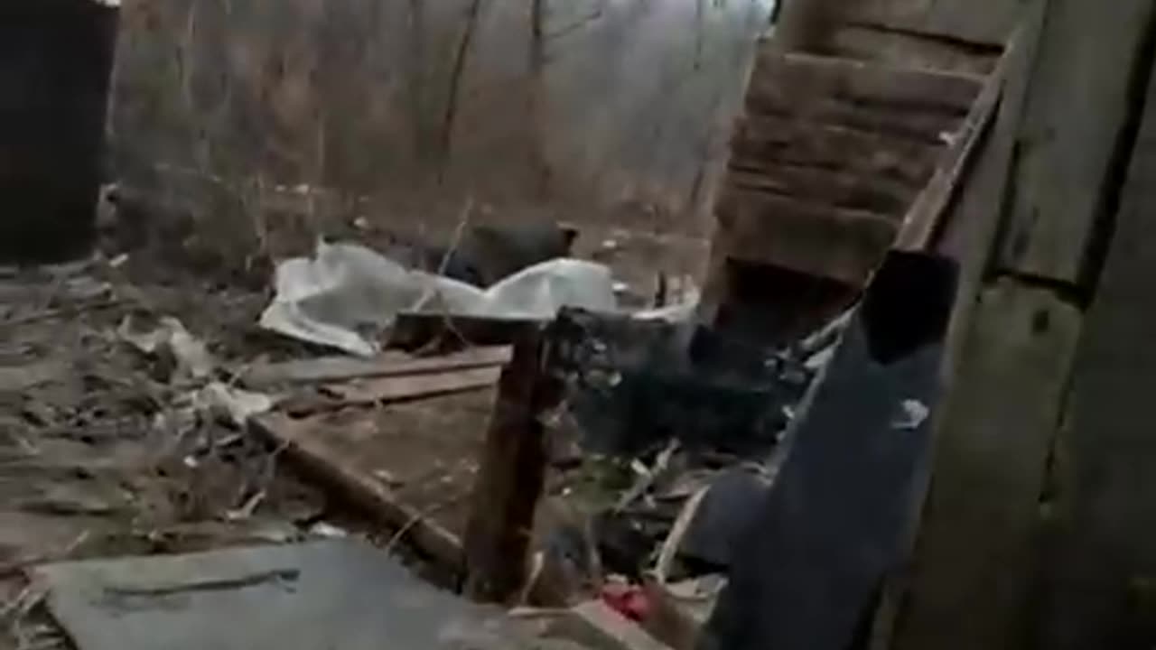 Ukrainian soldier waiting for Russian shelling to pass