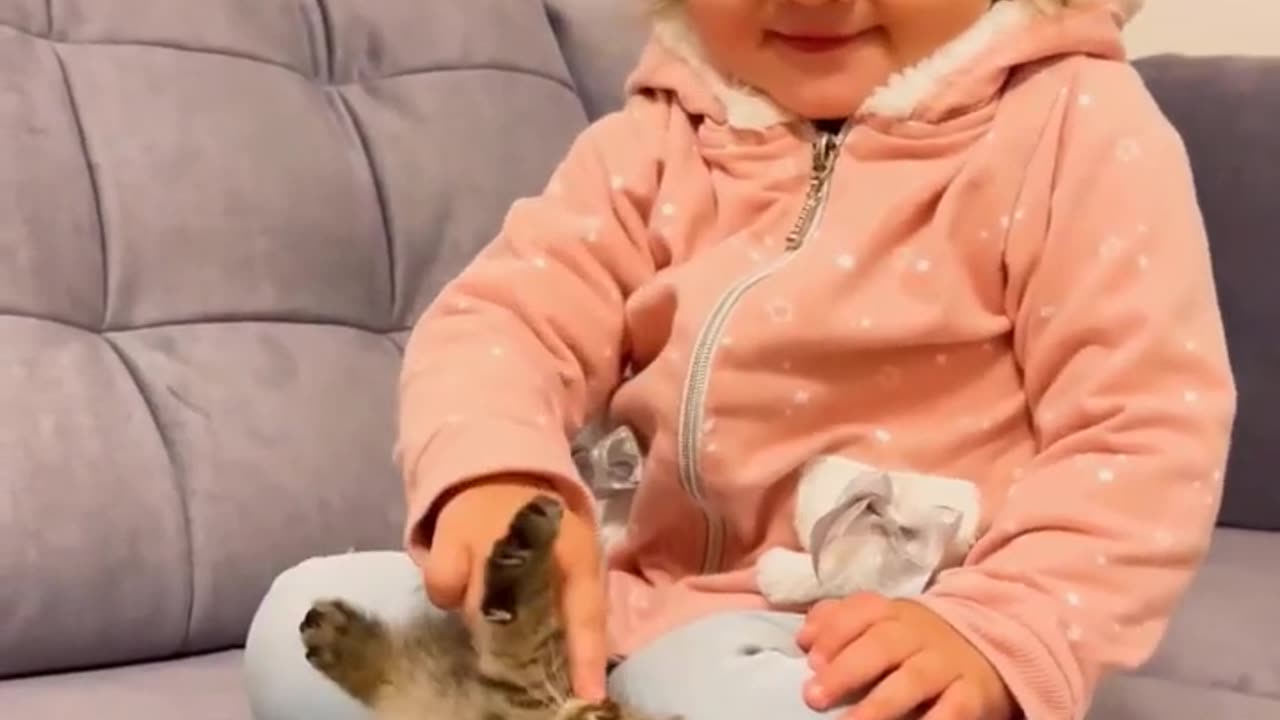 kids playing with cat