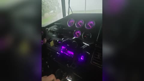 PURPLE DASH LIGHTS: DRIVING BACKWARDS IN THE RAIN