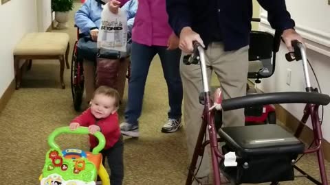 Baby and Great Grandfather Using Walkers Side by Side