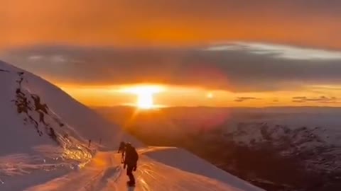 Skiing to enjoy the sunrise romance.