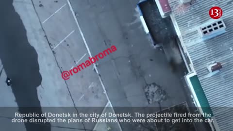 Drone targets Russian policemen trying to get into a car in Donetsk