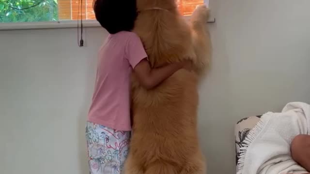 Little boy hugs his doggy best friend