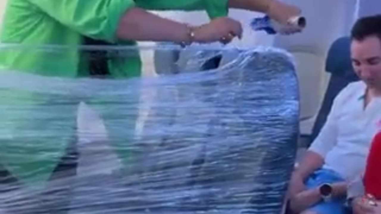 Retard on TikTok makes a plastic room on the Airplane