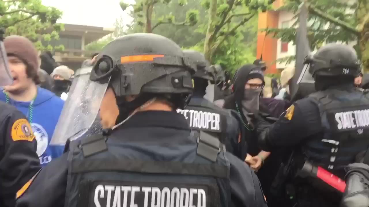 June 15 2017 1.2 Evergreen free speech rally Antifa spraying people in the face police separate them