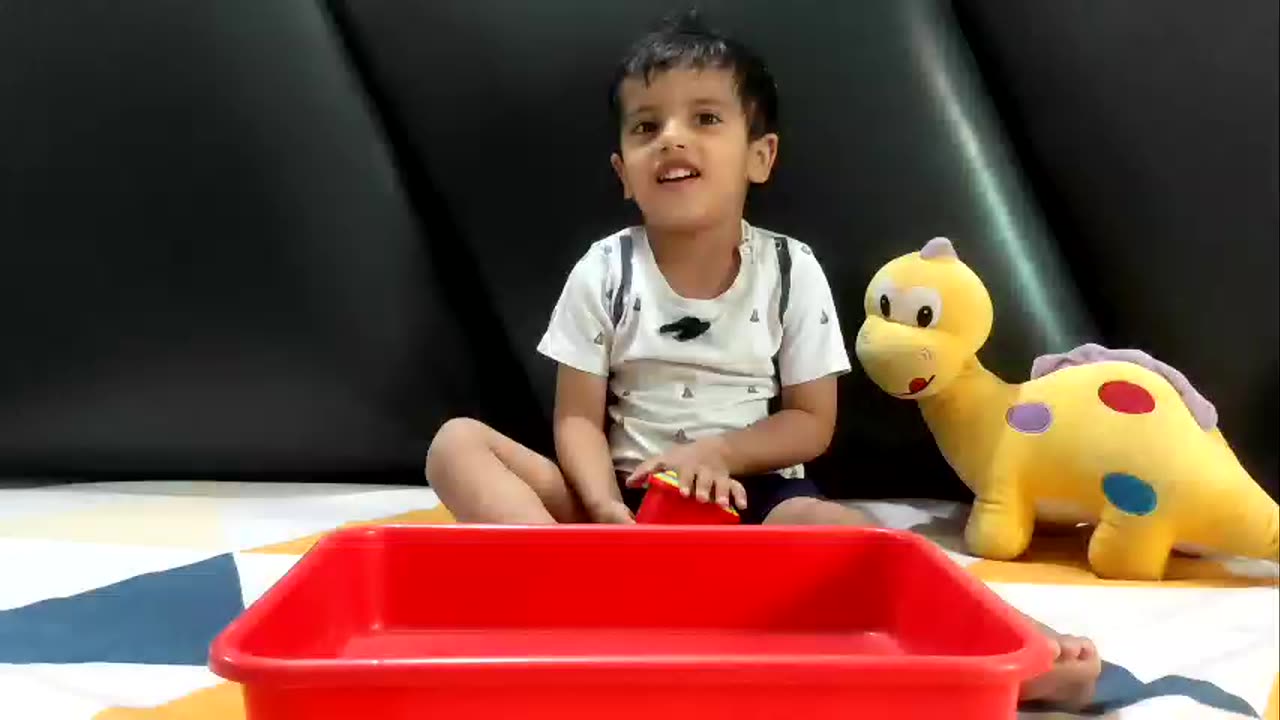 Baby playing with stacking cups 👶