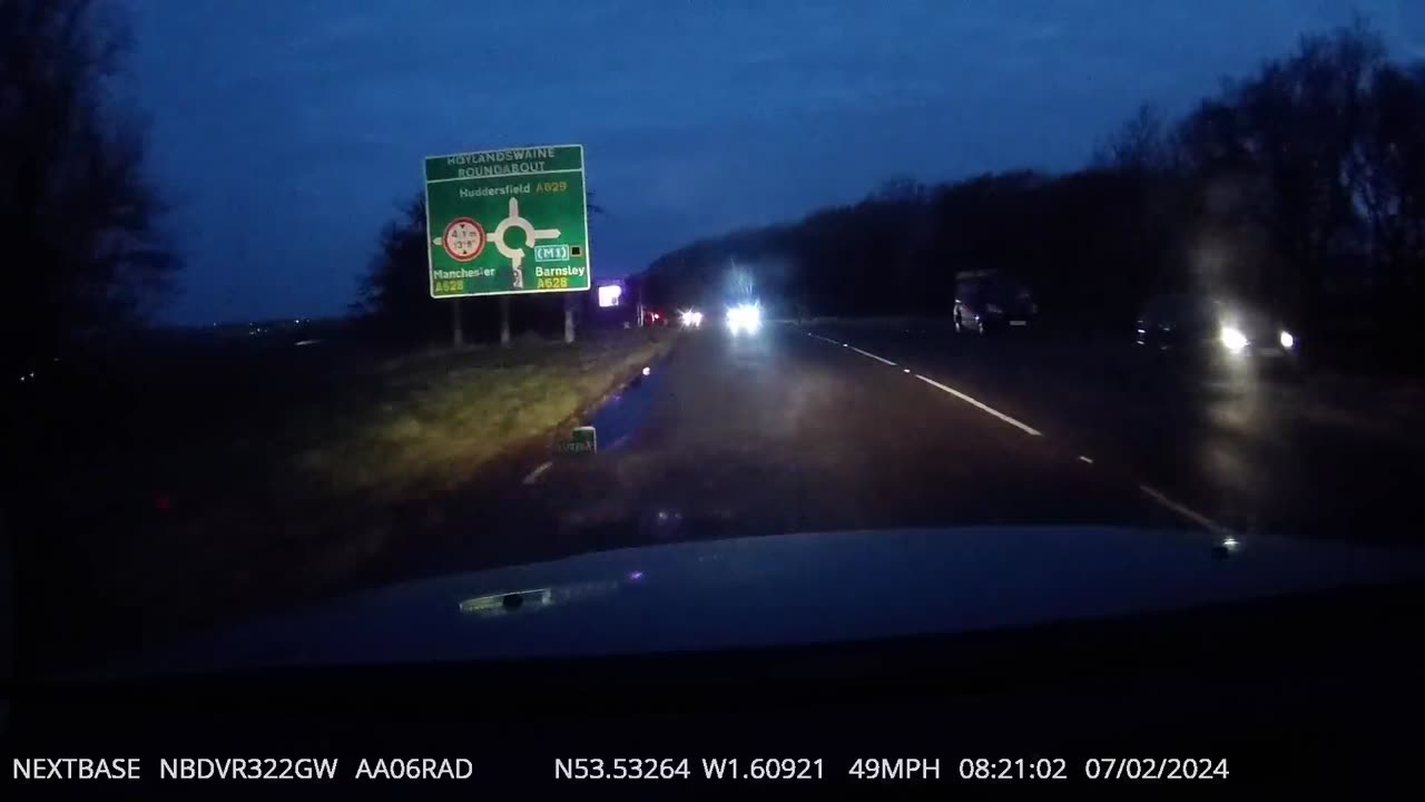 Pedestrian Walks Across Dark Morning Road