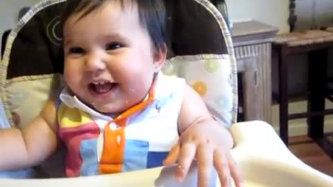 Adorable baby cracking up 