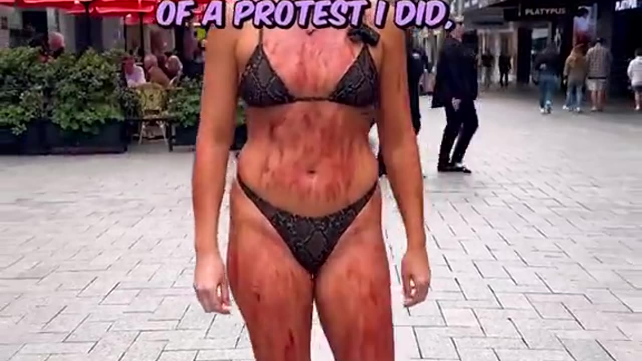 Tash Petersen protests in a bikini and fake blood