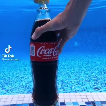 Opening of Lid of Coke in Water.
