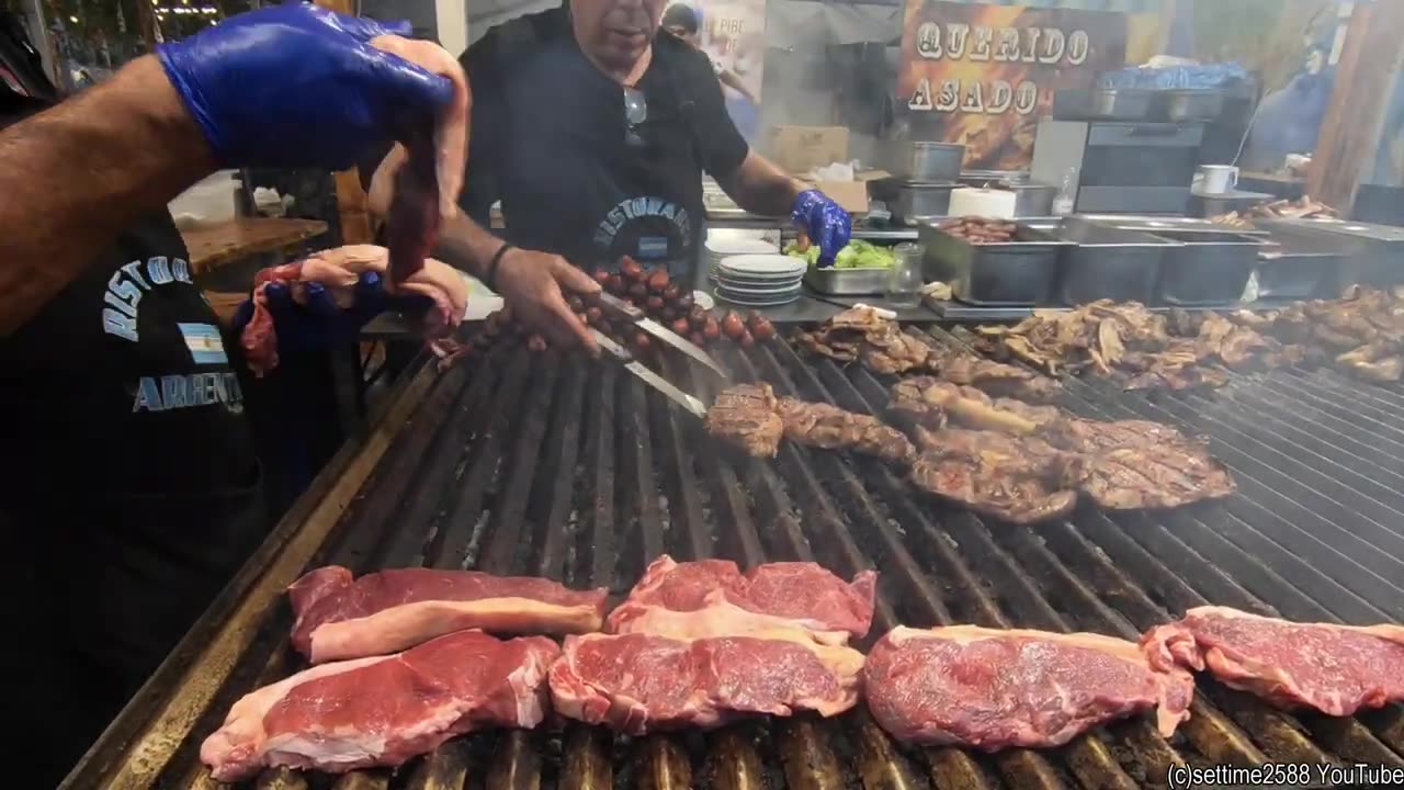 Huge Amount of Grilled Meat from Argentina. Asado, Steaks, Ribs, Sausages. Street Food