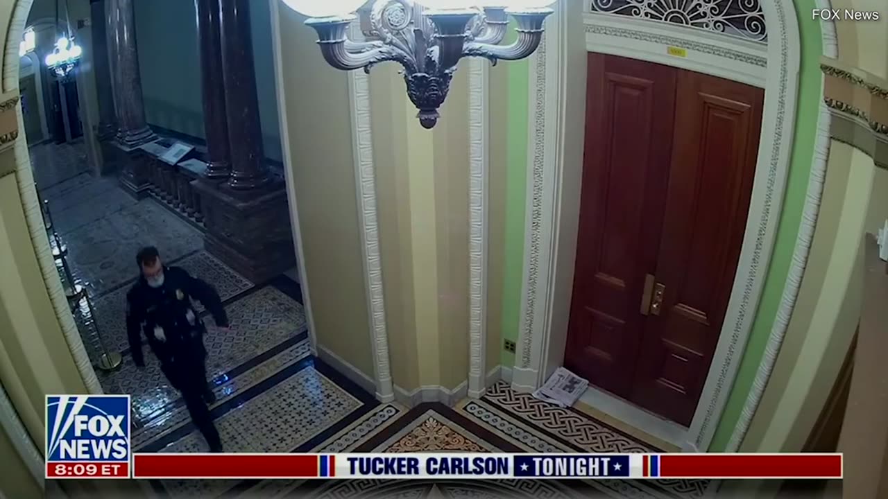 Tucker Carlson Show: Jake Chansley being escorted by USCP
