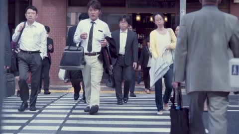 tokyo japan june 23 2015 people cross the street in a business district of tokyo Free Stock Footage