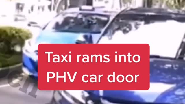 Taxi rams into PHV car door