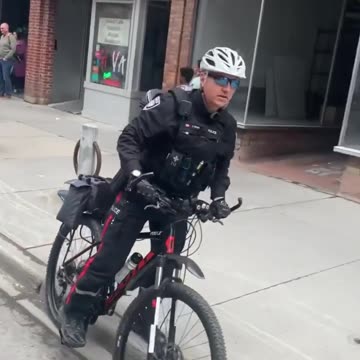 J. IRVING Ottawa Police Bully with a bicycle