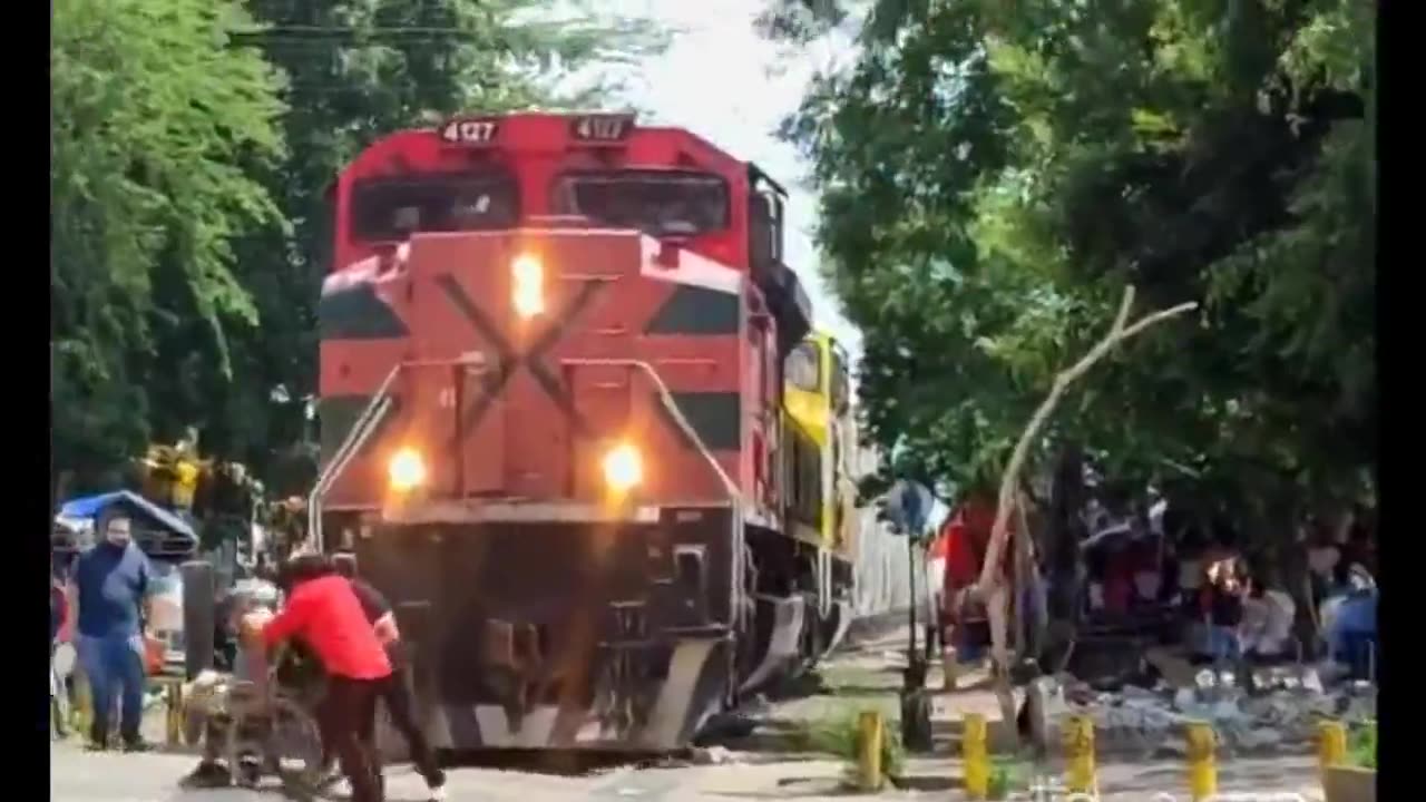 Man in a wheelchair is almost crushed by a train