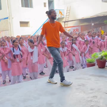 Indian school dance teacher Teaching dance to little student