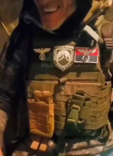 Ukrainian military with III Reich Nazi eagles on his chest, instead of Swastikas on their claws