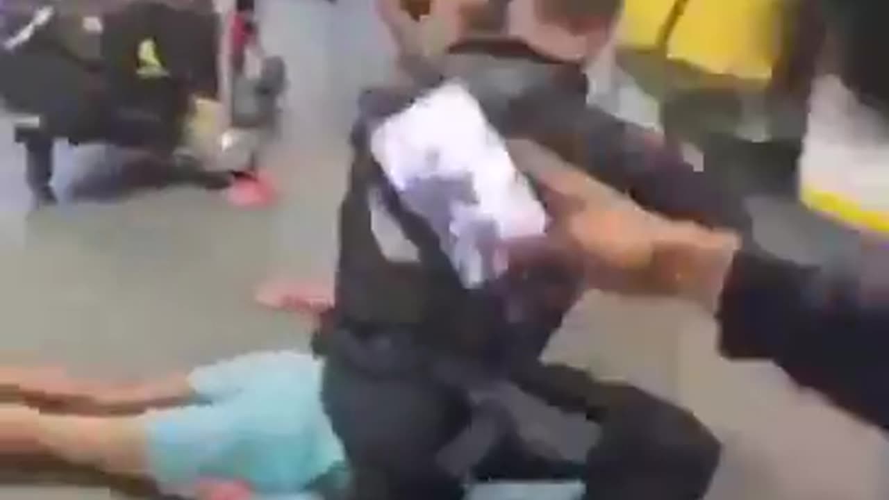 A police officer seen kicking and stamping an Arab man in the head