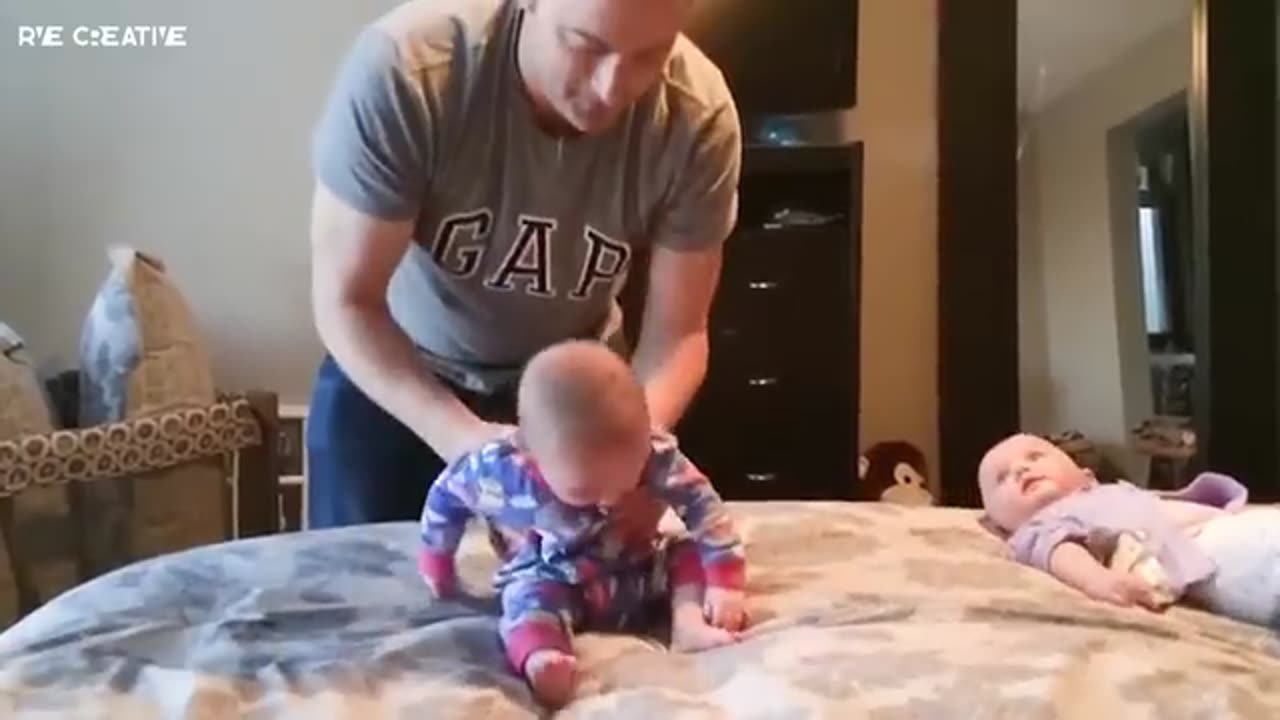 cute twin babies trying to fight