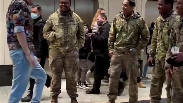 The man in front of the US soldiers