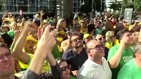 Supporters cheer as Bolsonaro returns to party HQ in Brazil