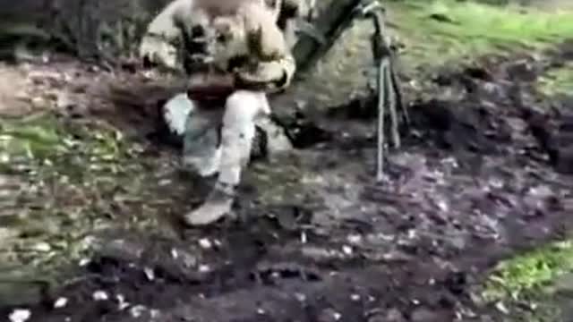 Ukrainian Special Operations Forces members firing a 120mm mortar