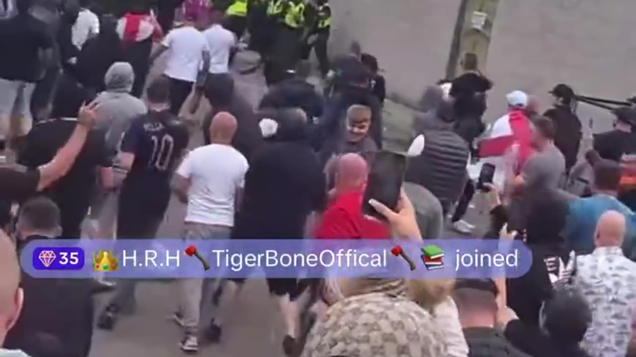 British police guarding Rotherham immigration hotel are now being stoned by British people!