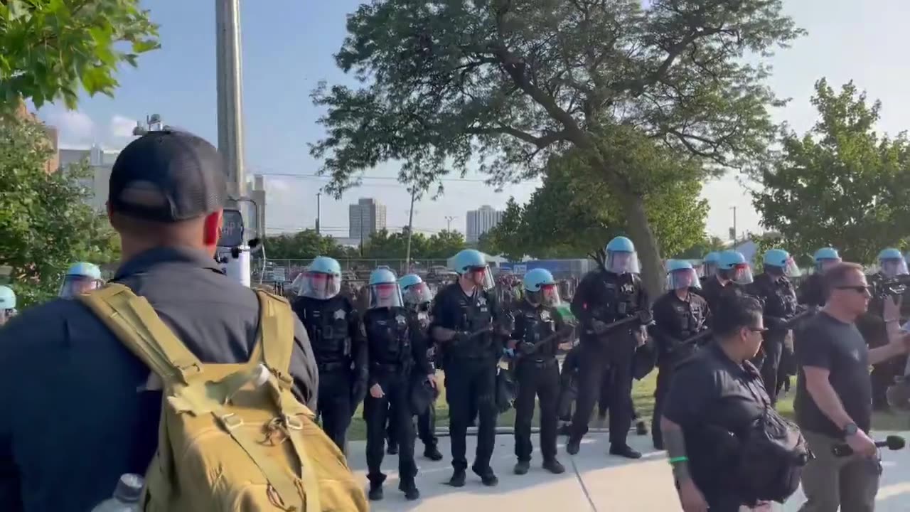 Chicago police chanting “move now” approach the violent mob at DNC