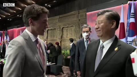 China and Canada leaders caught having tense exchange on camera - BBC News