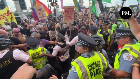 PROTESTERS IN CHICAGO CHANT "PIGGY, PIGGY, GO BACK HOME, OR WE'LL BRING THE WAR HOME" AT POLICE ON EVE OF DNC