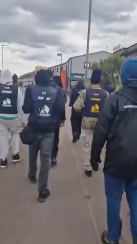 African Migrants roam UK Streets in Bulletproof Vests and Military Fatigues