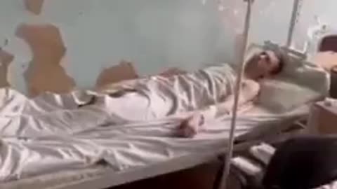 Footage of the Ukrainian Army holding a Russian Army captive. Notice how they have a bed and sheets