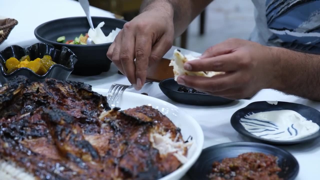 Amazing Iraqi-style grilled fish around charcoal and wood fire | Erbil street food