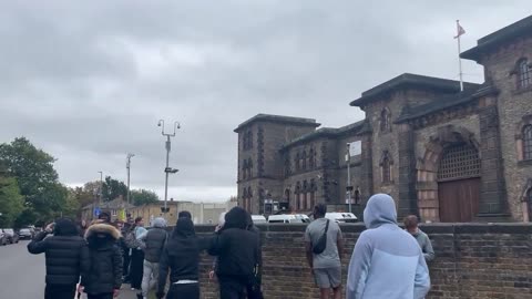 And so it begins... Jubilant crowds gather at HMP Wandsworth