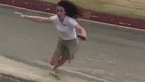 Banana peel thrown at girl she jumps over it and lands on it then slips