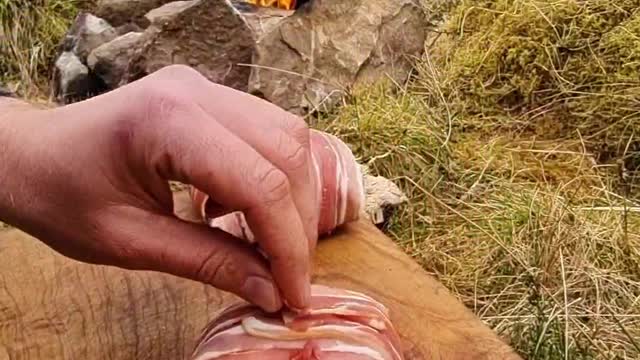 A meal of delicious meat with a few ingredients cooked in the wild