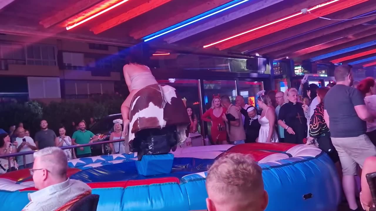 😱 OMG! Pretty Girl Fails at Mechanical Bull Ride in Benidorm | Spain 2024