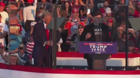 Elon Musk jumps around on stage as he joins Trump at rally