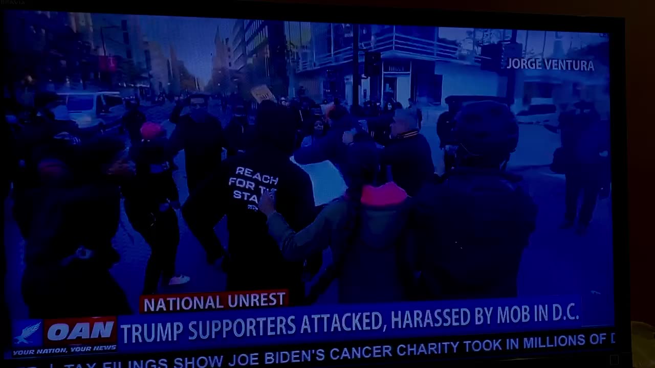 11/15/24 OAN DC March disrupted by libs and attacked Trump supporter