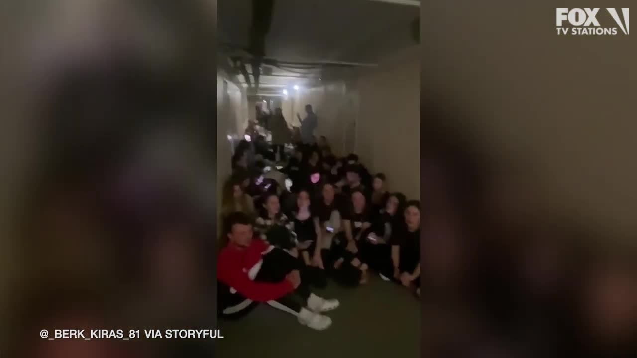 Students sing songs while sheltering from fighting in Kyiv