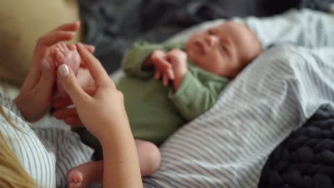 A mother massages her child