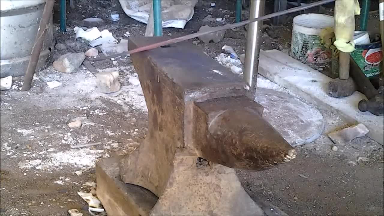 hand forging a sword from a Solid round bar part 2 forging the tang and the edge and ridge / taper