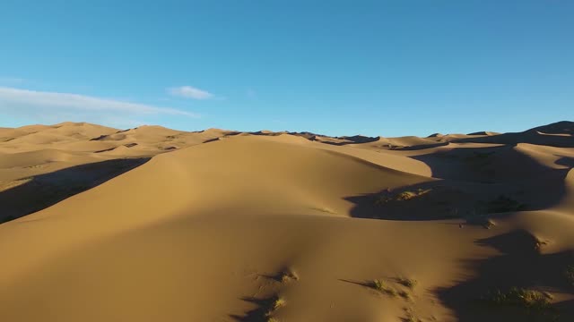 The dune desert in the blue sky