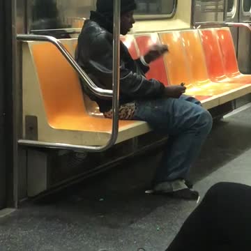 Two men smoke on subway train