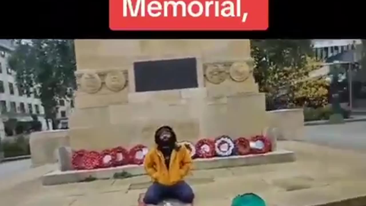 Tensions erupt as a man challenges a Muslim praying on a war memorial.